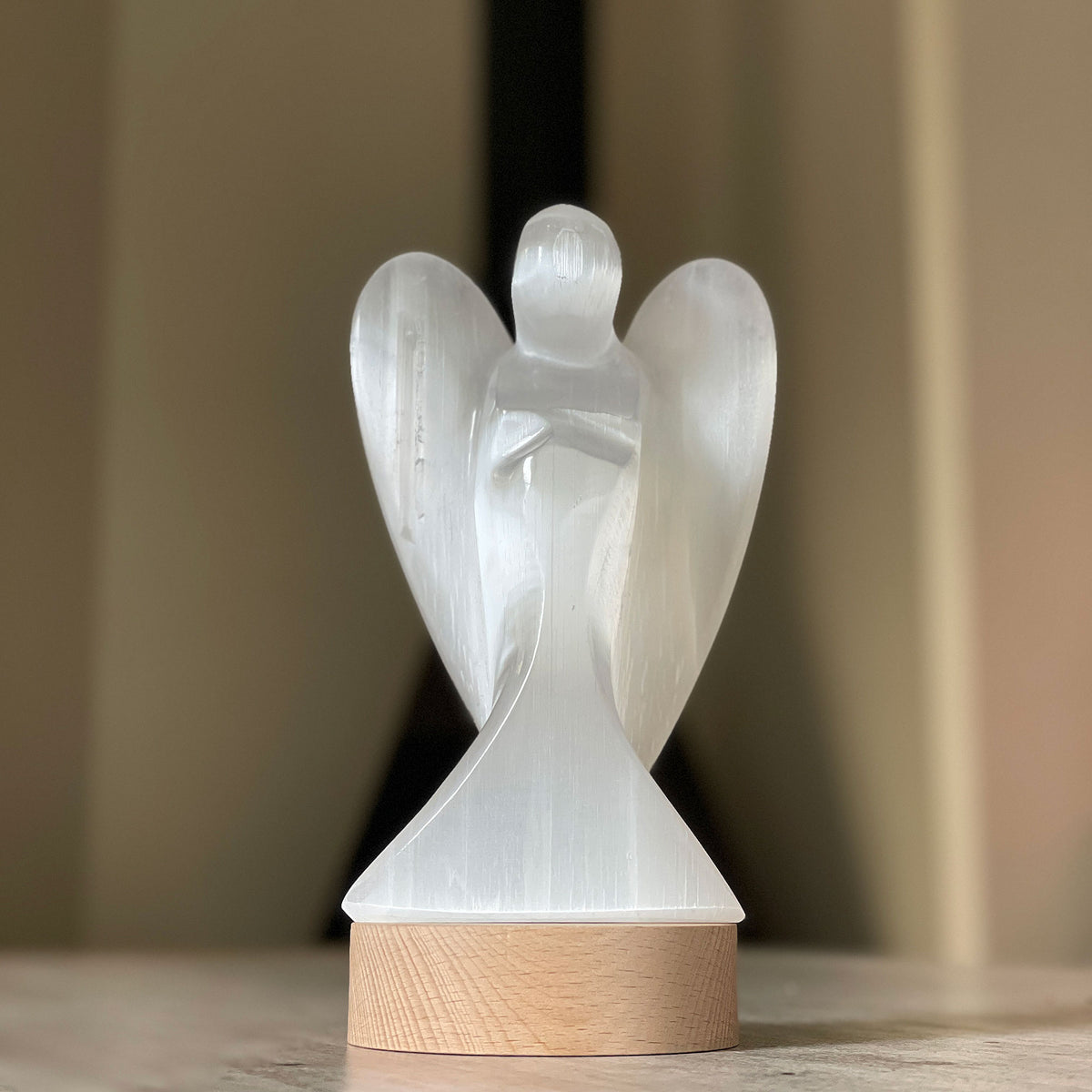 Selenite Lamp - Angel - Selenite is a beautiful and versatile crystal that offers numerous benefits, making it a popular choice for both decor and holistic purposes. Its natural beauty and unique translucent appearance make it an eye-catching addition to any home.