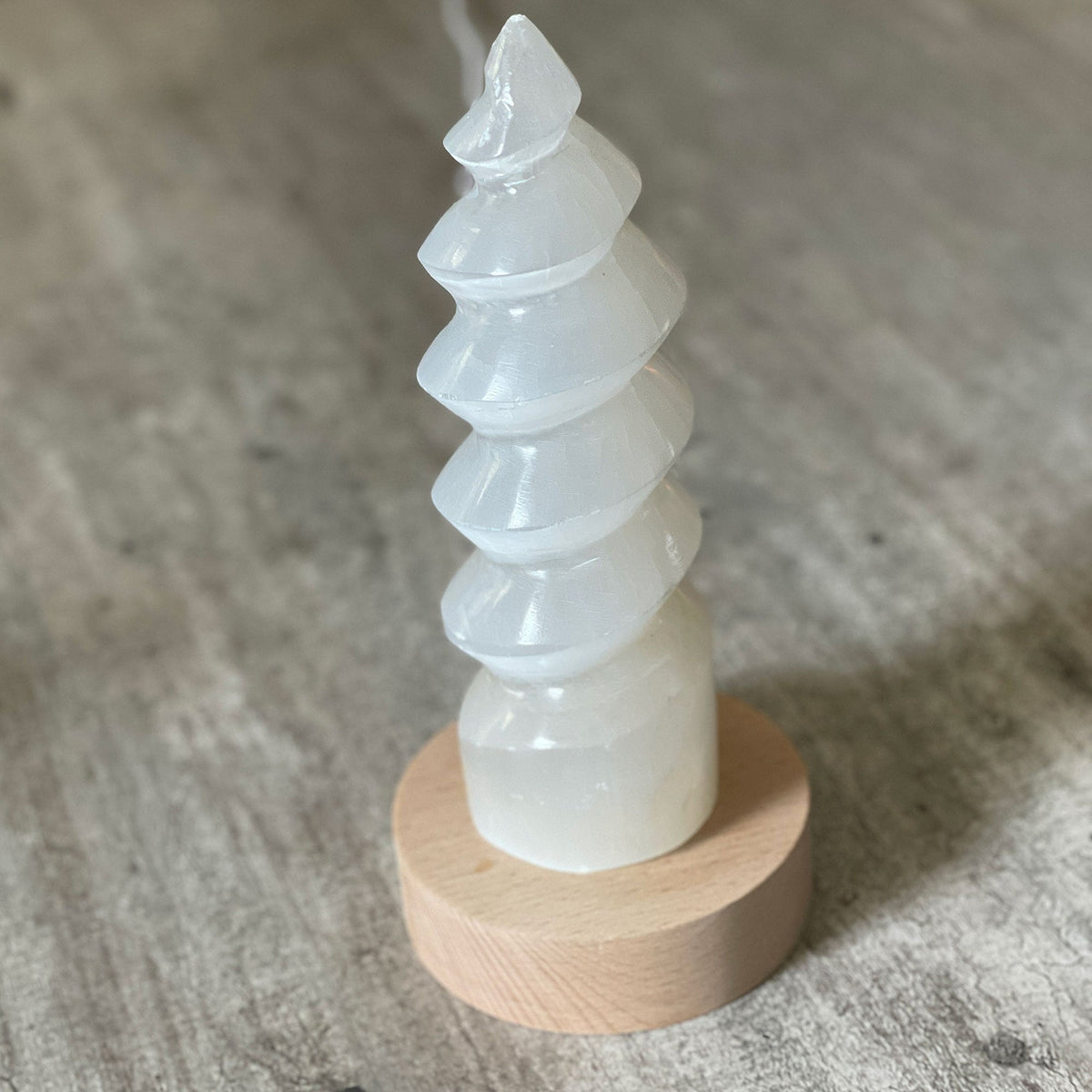 Selenite Lamp - Twister Large - Selenite is a beautiful and versatile crystal that offers numerous benefits, making it a popular choice for both decor and holistic purposes. Its natural beauty and unique translucent appearance make it an eye-catching addition to any home.