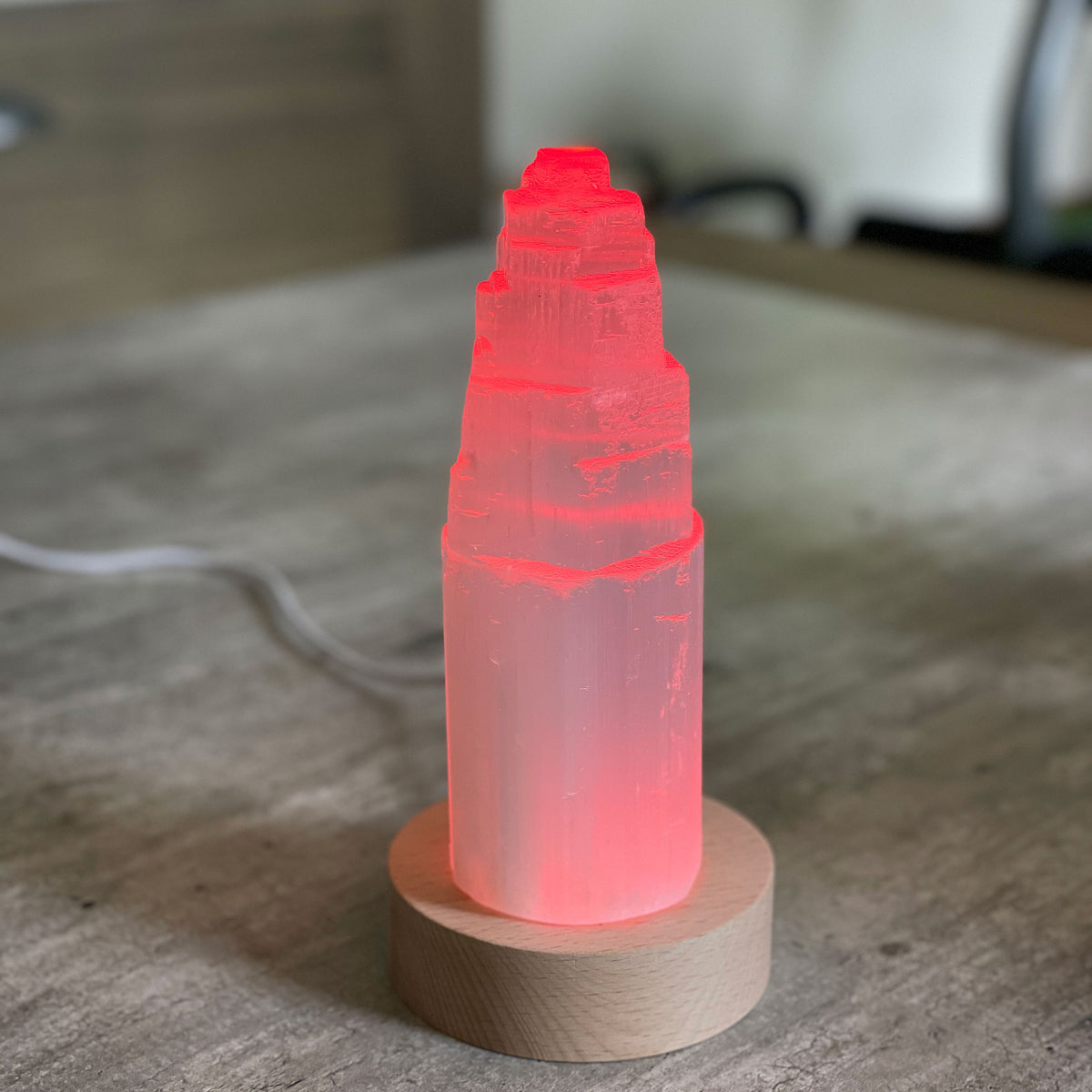 Selenite Lamp - Tower Small - Selenite is a beautiful and versatile crystal that offers numerous benefits, making it a popular choice for both decor and holistic purposes. Its natural beauty and unique translucent appearance make it an eye-catching addition to any home. Selenite emits a soft and warm glow, which makes it an excellent choice for a night light.